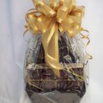 A basket filled with chocolates and a gold ribbon, perfect for gifting or indulging.