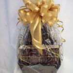 A basket filled with chocolates and a gold ribbon, perfect for gifting or indulging.