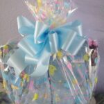 A Snack Time gift bag with a blue bow.