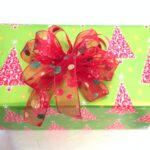 A green and red Holiday Paper GT with a red bow.