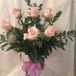 Pink roses in a glass vase.