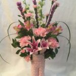 Pink lilies and lilies in a vase.