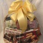 A basket filled with chocolates and cookies.