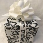 A black and white gift box with a bow.